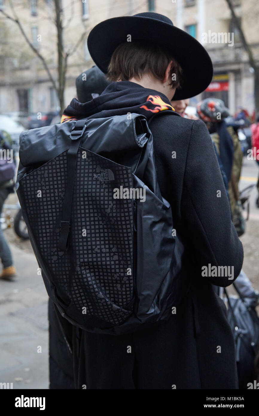 MILAN - JANUARY 15: Man with black 'The North Face' backpack and hat before  Fendi fashion show, Milan Fashion Week street style on January 15, 2018 in  Stock Photo - Alamy
