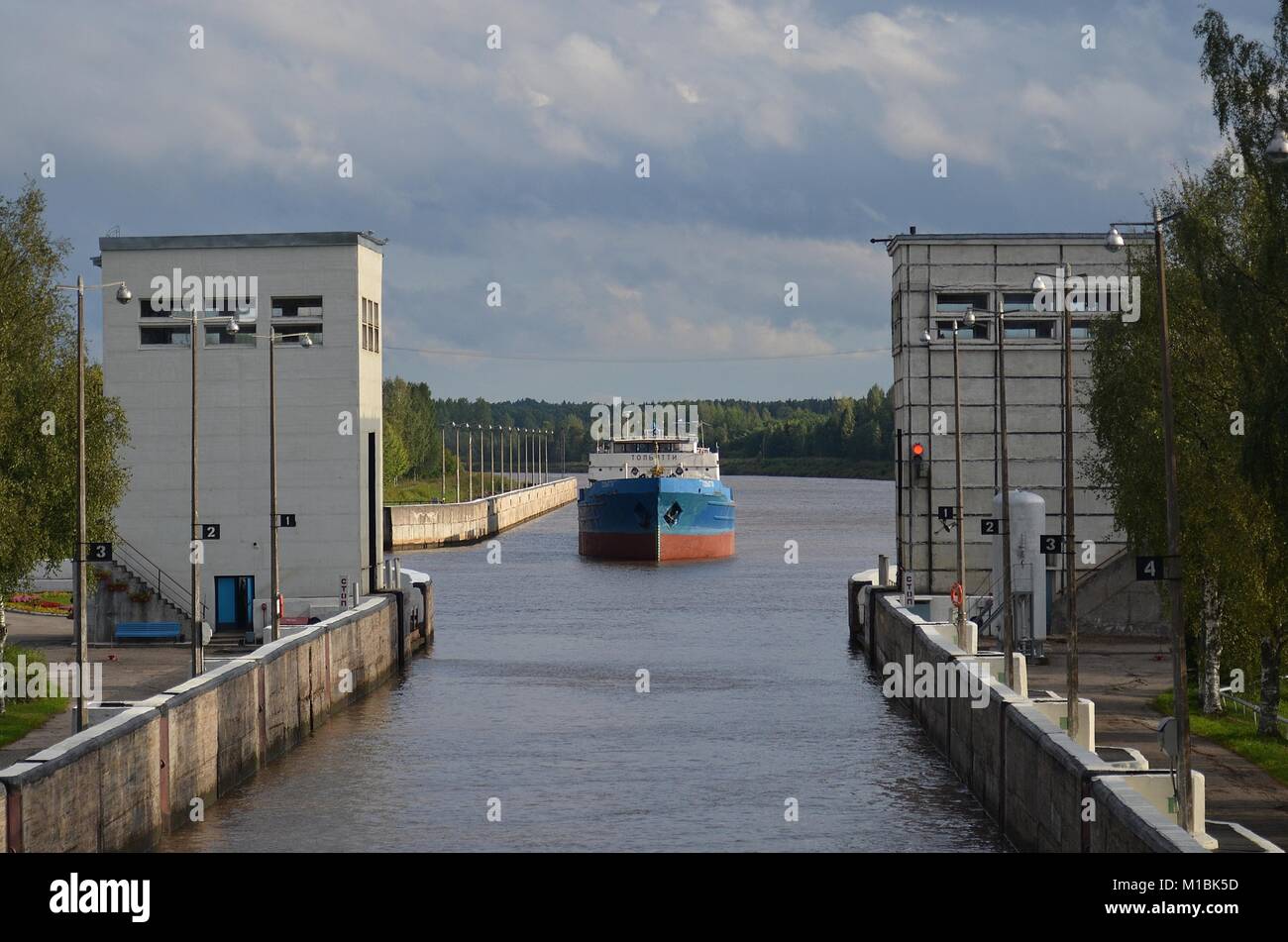 FREIGHTER 'TOLYATTI'  APPROACHING LOCK 1 ON THE KOVZHA RIVER BOUND FOR LAKE LADOGA, RUSSIA. Stock Photo