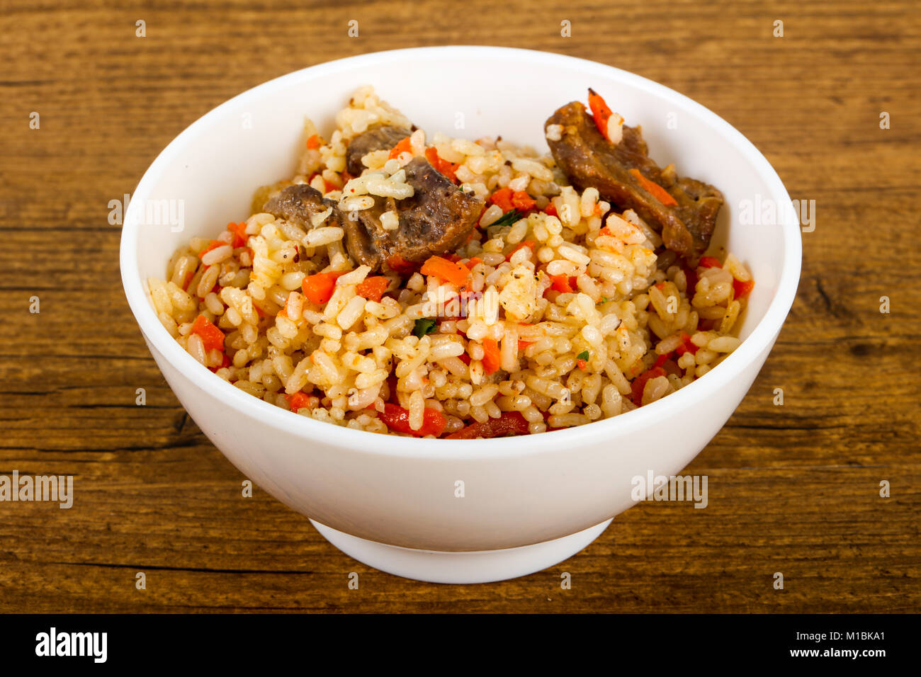 Asian rice - Plov with meat and carrot Stock Photo - Alamy