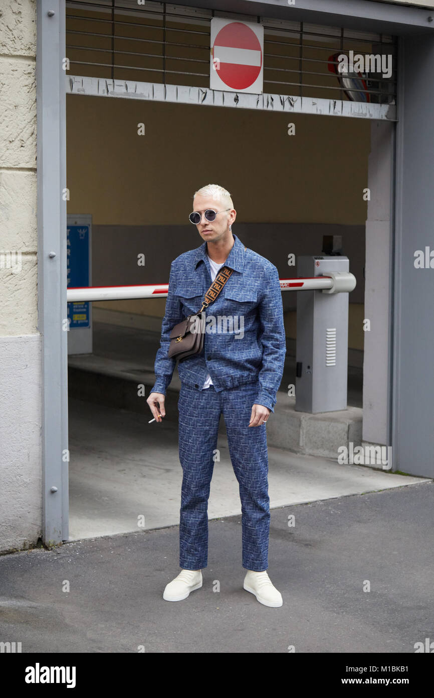 MILAN - JANUARY 15: Man with blue Fendi jacket and trousers before Represent fashion show, Milan Fashion Week street style on January 15, 2018 in Mila Stock Photo