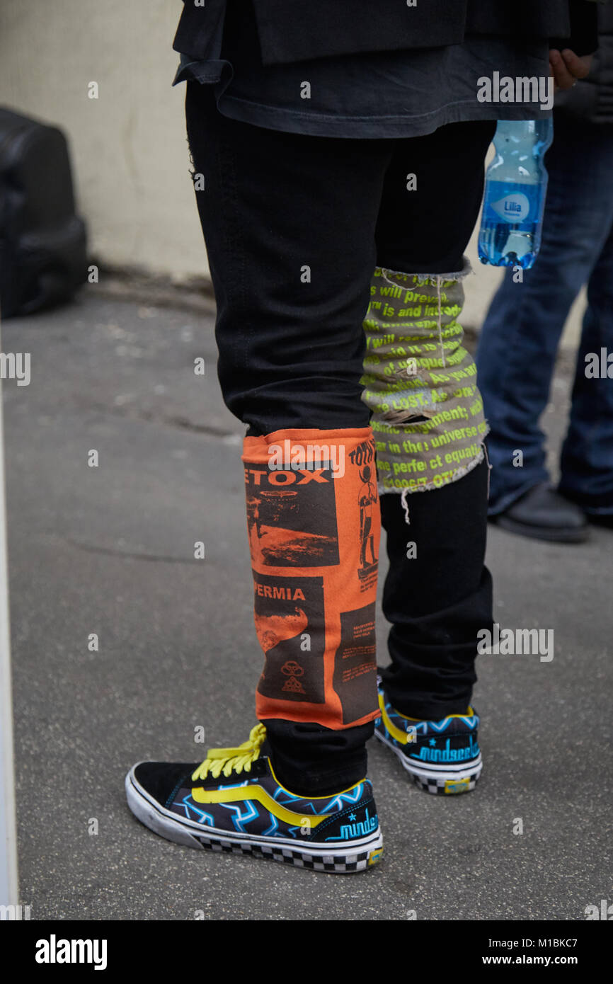 MILAN - JANUARY 15: Man with Mindseeker Vans shoes ad black trousers with  orange and green detail before Represent fashion show, Milan Fashion Week  st Stock Photo - Alamy