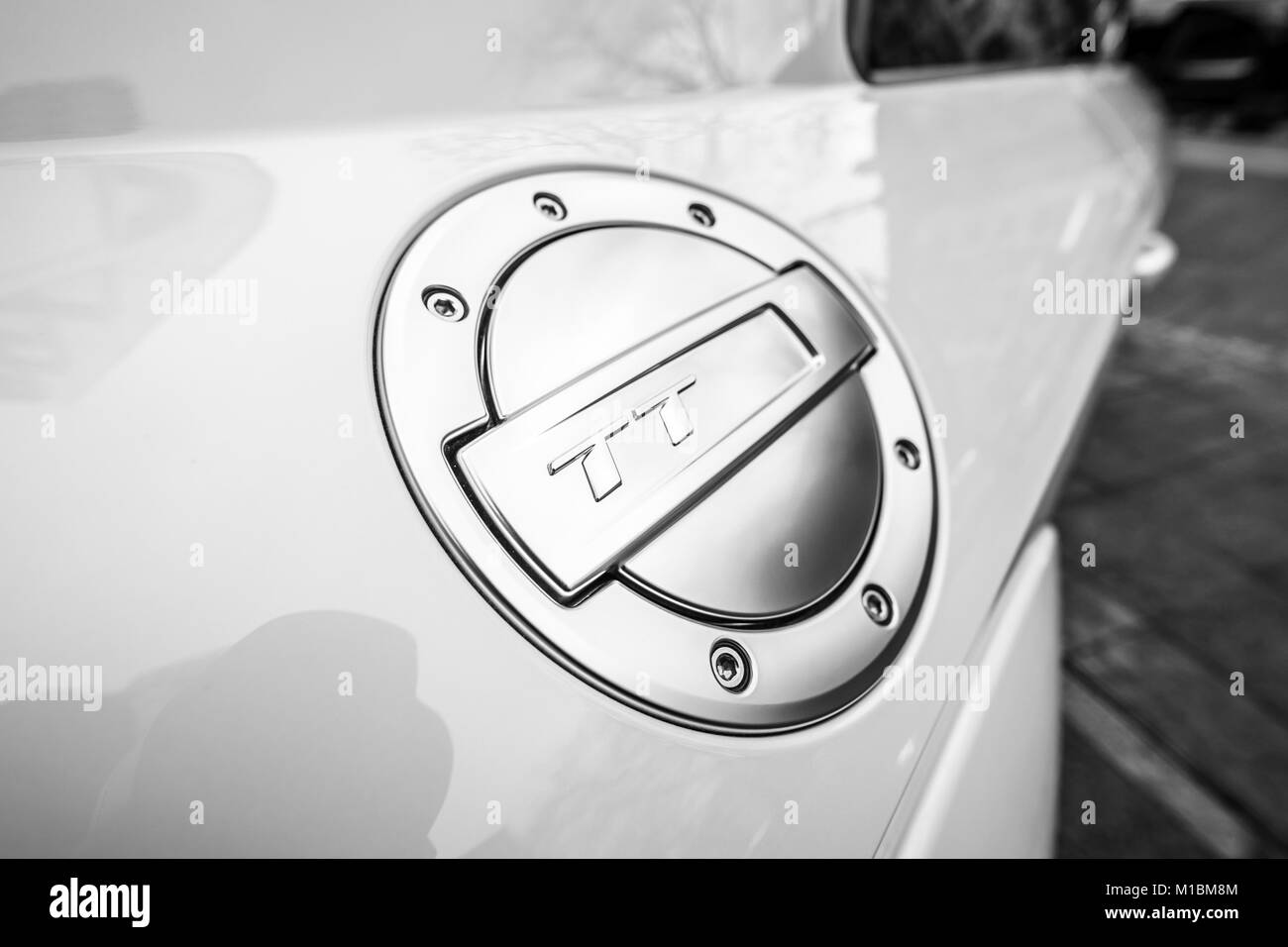 BERLIN - DECEMBER 21, 2017: Showroom. Fuel tank cap of the compact sports coupe Audi TT RS. Since 2016. Black and white. Stock Photo
