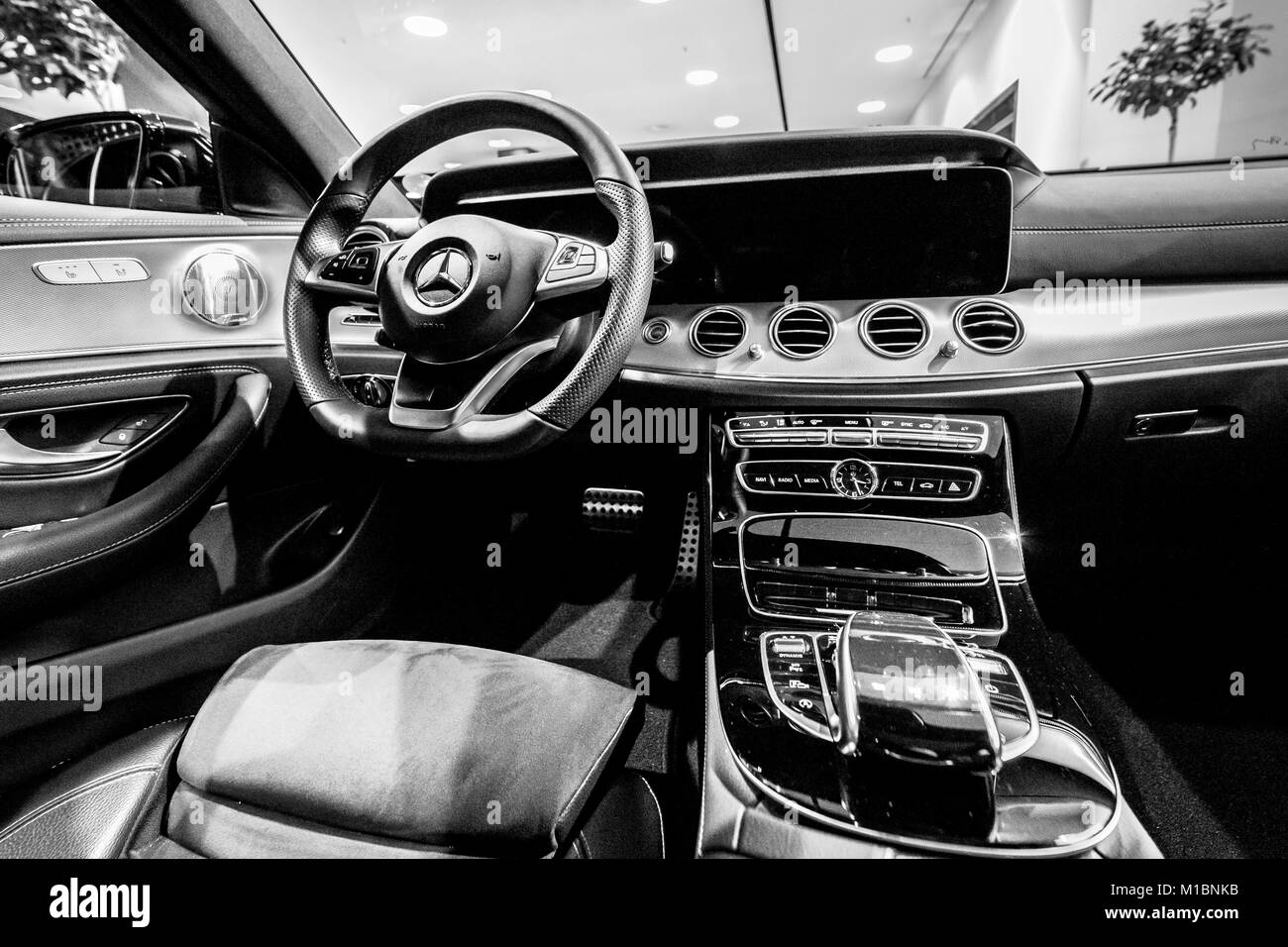 BERLIN - DECEMBER 21, 2017: Showroom. Cabin of the executive car Mercedes-Benz E-Class E220d (W213). Black and white. Since 2017. Stock Photo