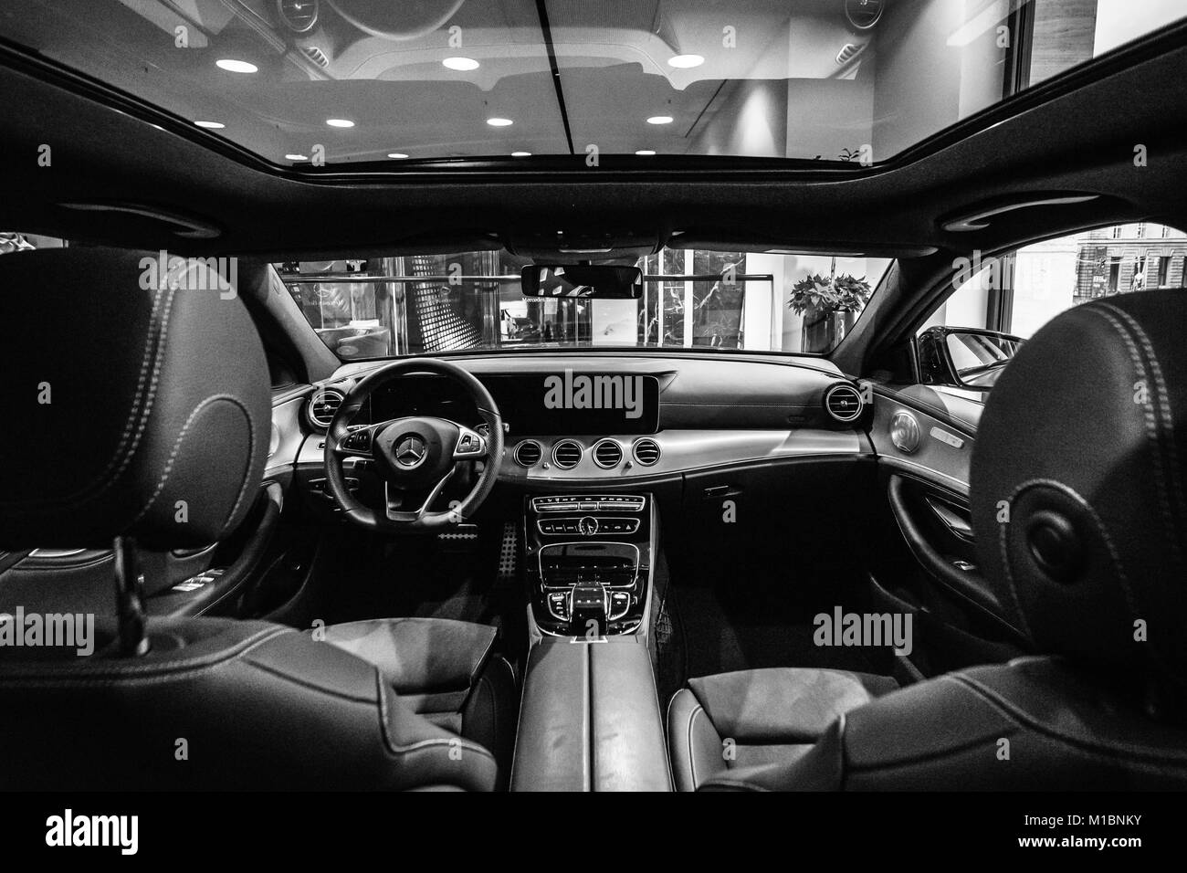 BERLIN - DECEMBER 21, 2017: Showroom. Cabin of the executive car Mercedes-Benz E-Class E220d (W213). Black and white. Since 2017. Stock Photo