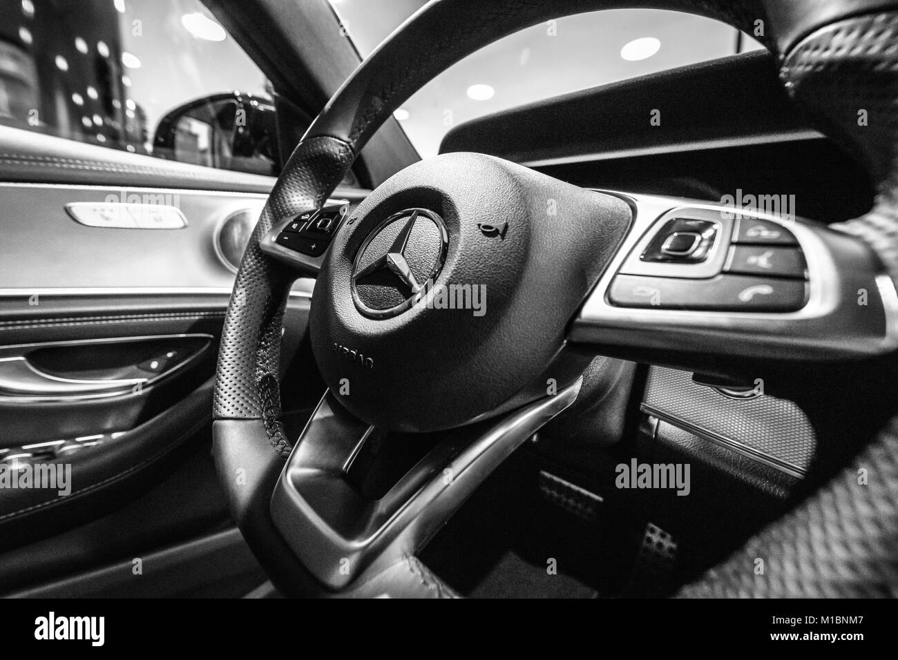 BERLIN - DECEMBER 21, 2017: Showroom. Cabin of the executive car Mercedes-Benz E-Class E220d (W213). Close-up. Black and white. Since 2017. Stock Photo