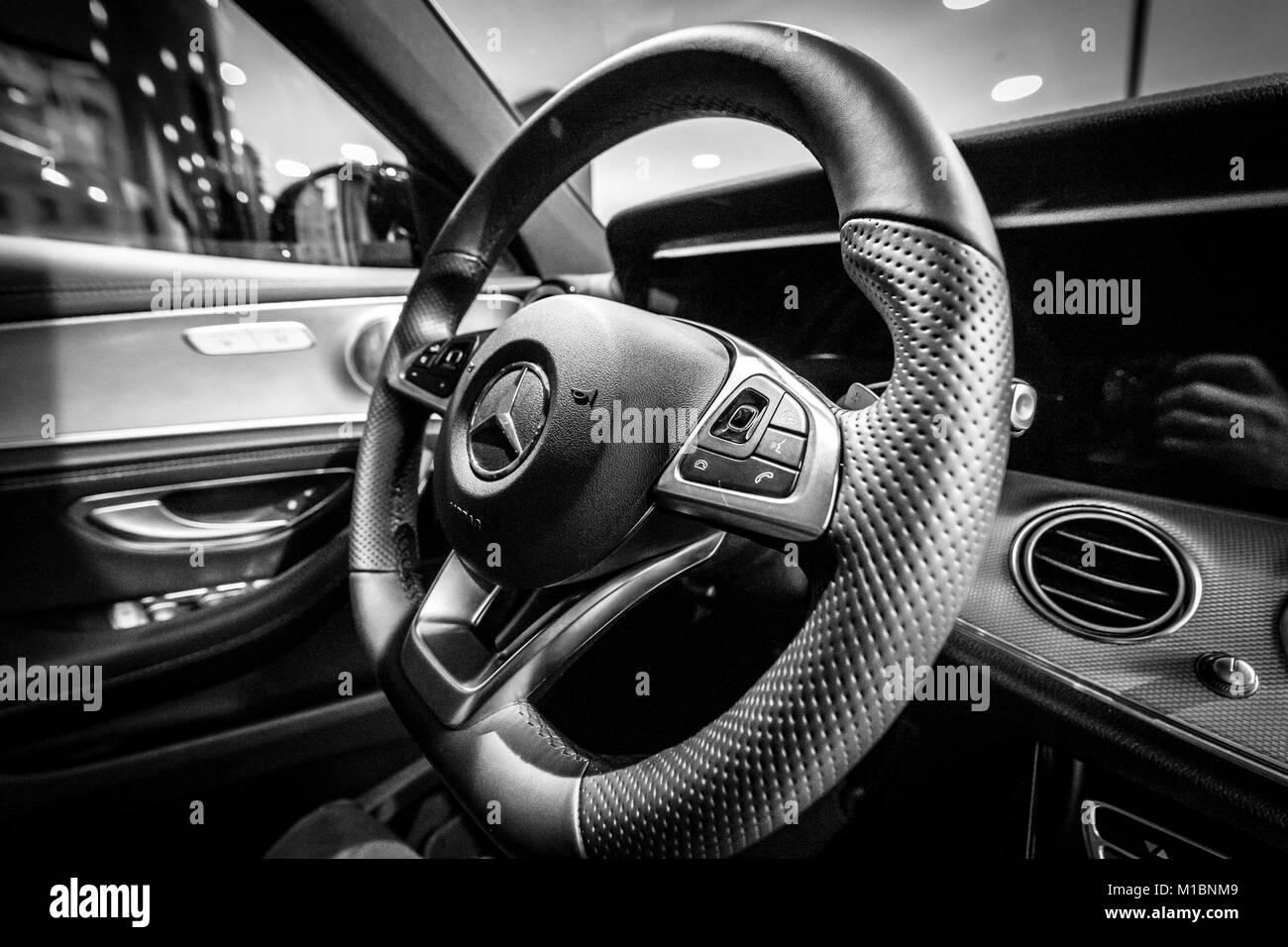 BERLIN - DECEMBER 21, 2017: Showroom. Cabin of the executive car Mercedes-Benz E-Class E220d (W213). Close-up. Black and white. Since 2017. Stock Photo