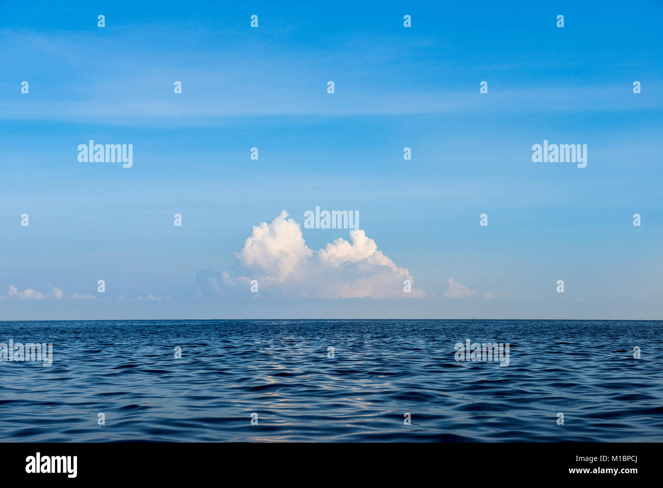 View over blue sea, clouds on the horizon, Lovina Beach, Bali, Indonesia Stock Photo