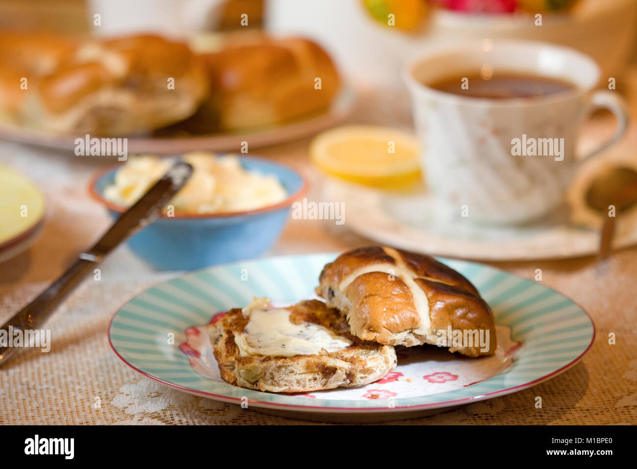 Toasted Hot Cross Bun with melted butter Stock Photo Alamy