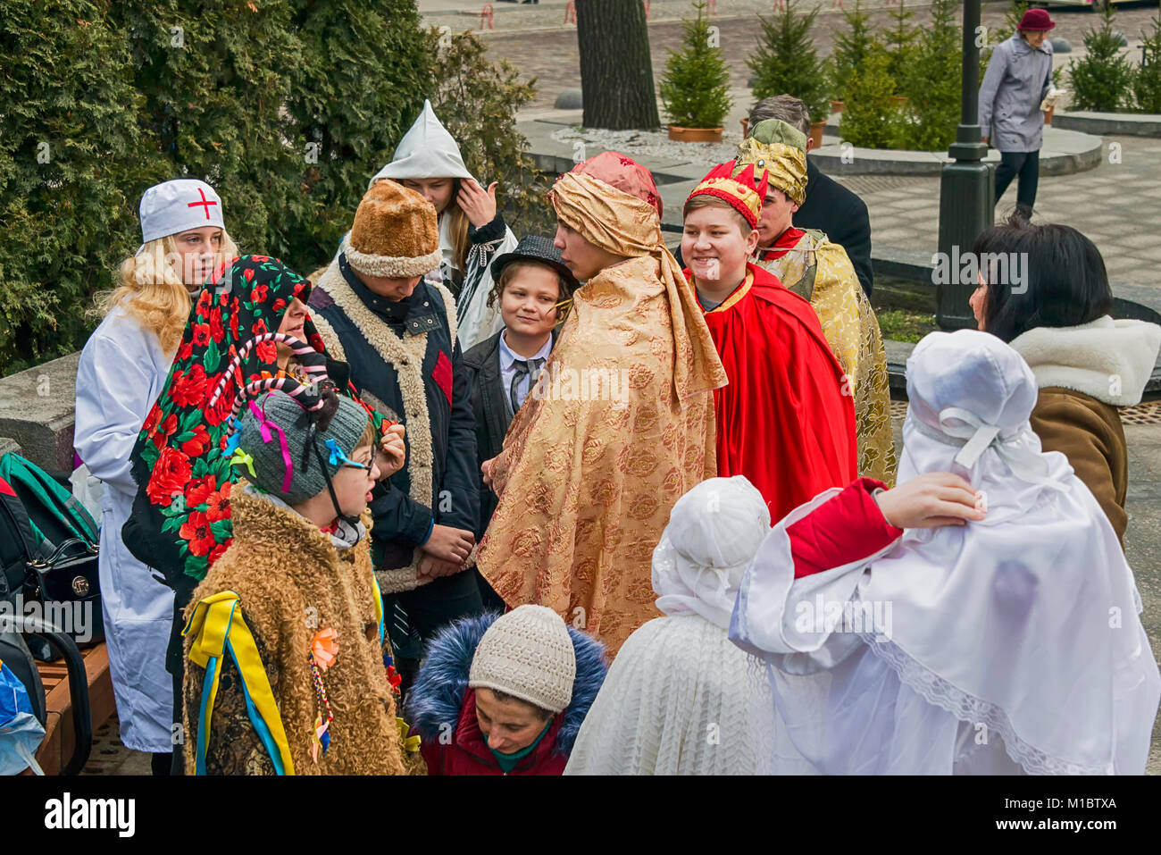 Lviv, Ukraine - January 07, 2018:  Christmas events in the center of the city. Unknown young people, in theatrical costumes, are photographed before s Stock Photo