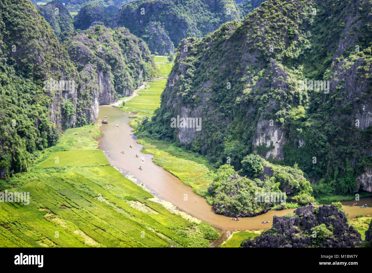 Aerial view of the river among rice fields and limestone mountains, vietnamese scenic landscape at ninh Binh, Vietnam Stock Photo