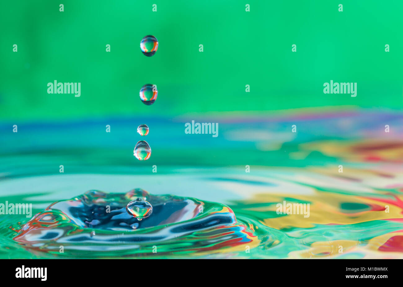 close up of colorful water droplets falling Stock Photo - Alamy