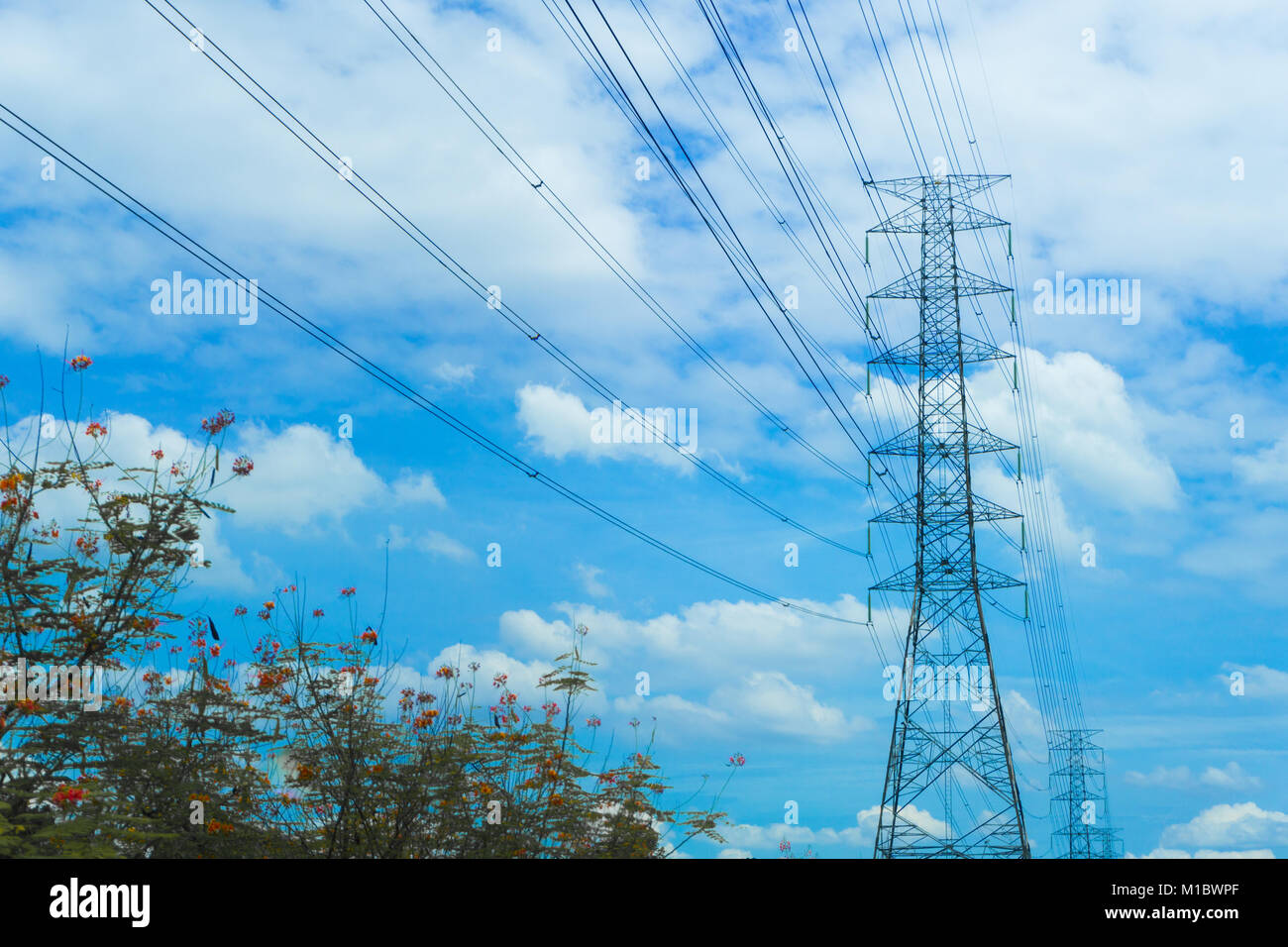 high voltage pole blue sky background Stock Photo - Alamy