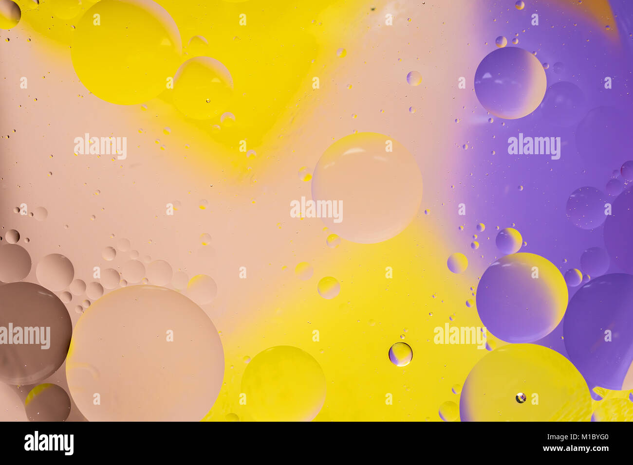 Abstract colorful Background Oil in Water surface Foam of Soap with Bubbles chemical effect macro shot close-up liquids do not mix Stock Photo