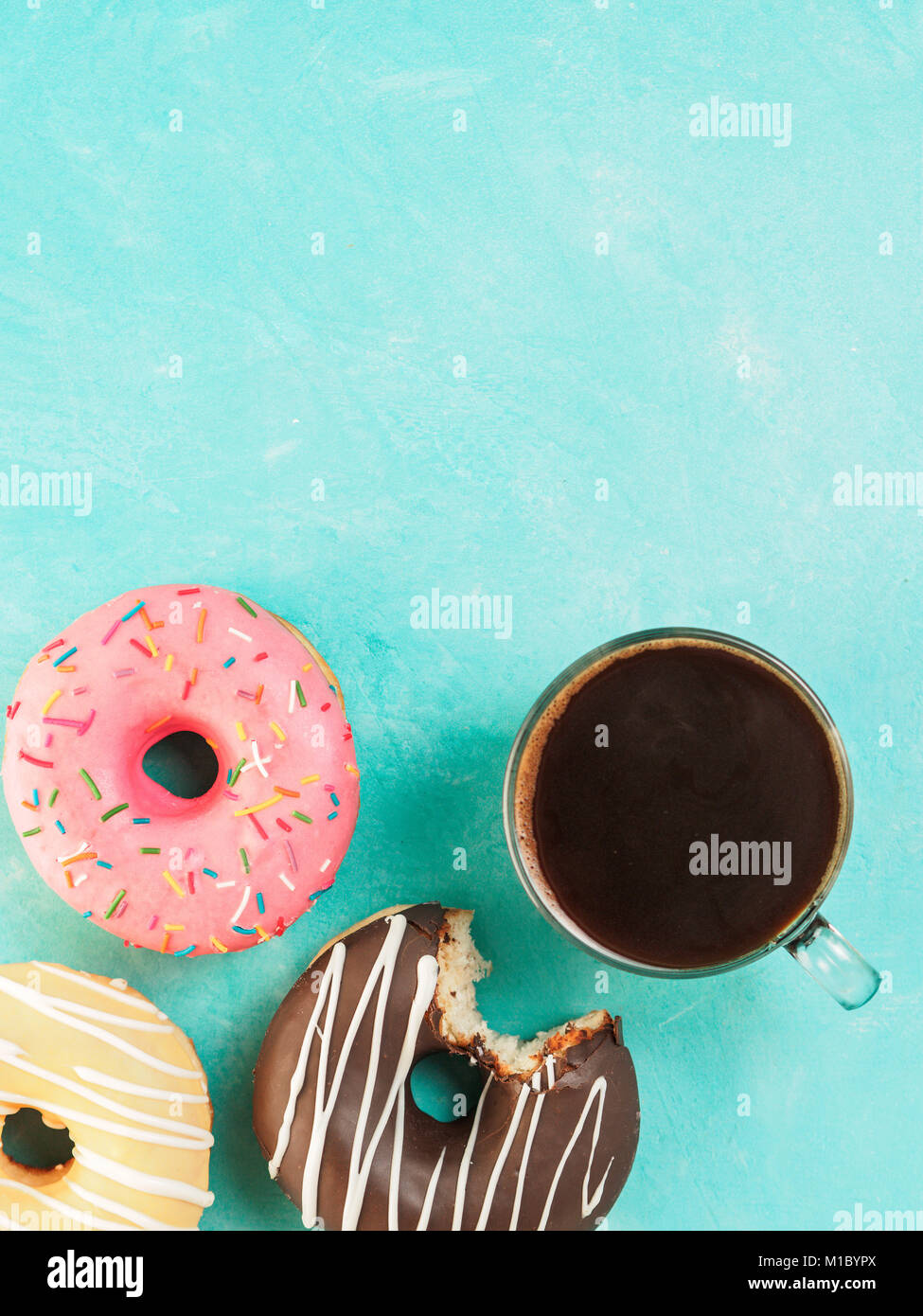 donuts on blue background , copy space, top view Stock Photo - Alamy