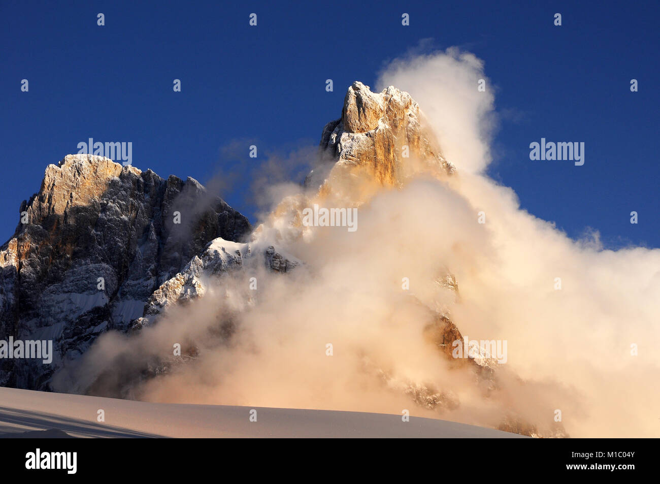 Dolomites Alps, South Tyrol, Italy. Cimon della Pala or Cimone with clouds in the Pale di San Martino Group. Stock Photo