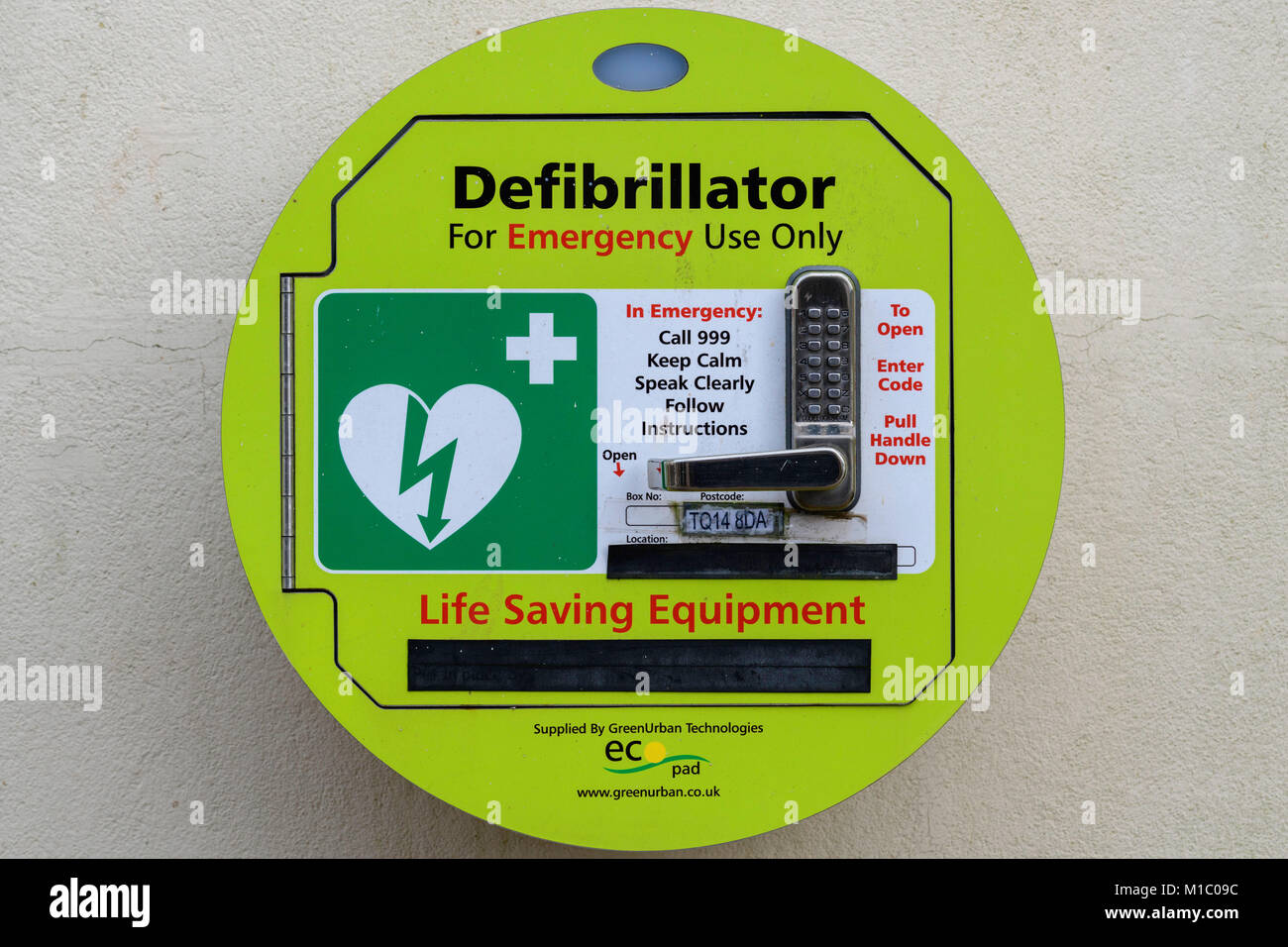 Defibrillator mounted on wall in a public open space Teignmouth south