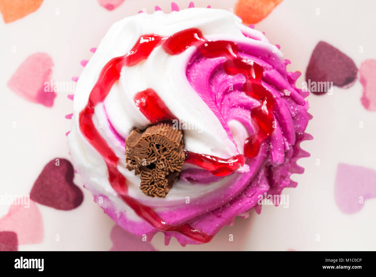 Raspberry Ripple cupcake with chocolate flake on hearts plate - looking ...