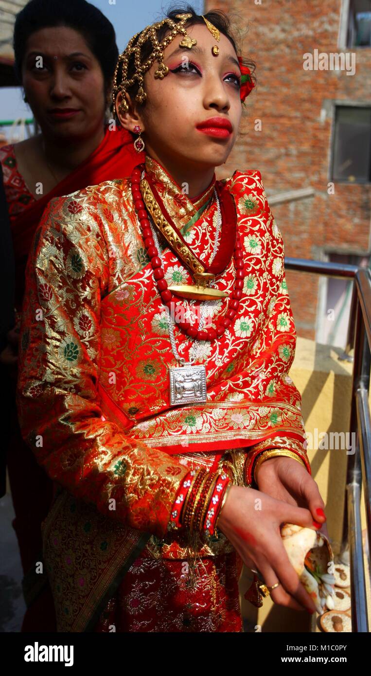 Kathmandu, Nepal. 29th Jan, 2018. Past living Goddess Kumari is praying to sun during a hindu ritual for girls named gupha nikaleko in Kathmandu, Nepal. Nepalese Hindu girls pass through a tradition of marrying Sun God before puberty by staying inside a room without sunlight for 12 days and then coming out for a meeting with Him in a function symbolizing a celestial marriage ceremony. Credit: Archana Shrestha/Pacific Press/Alamy Live News Stock Photo