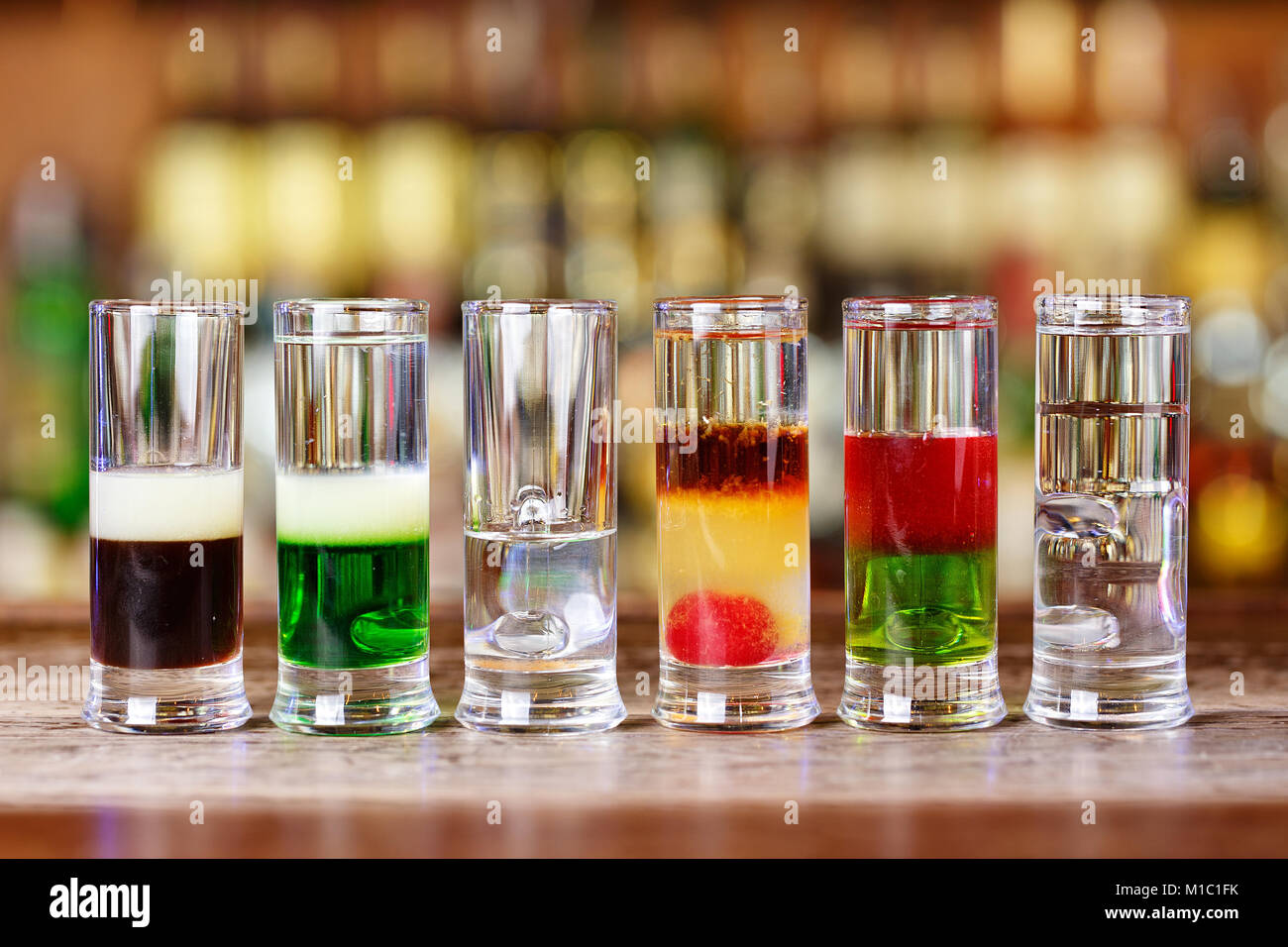 Summer cocktail menu. Cocktails stand in a row on the bar, space for text  Stock Photo - Alamy