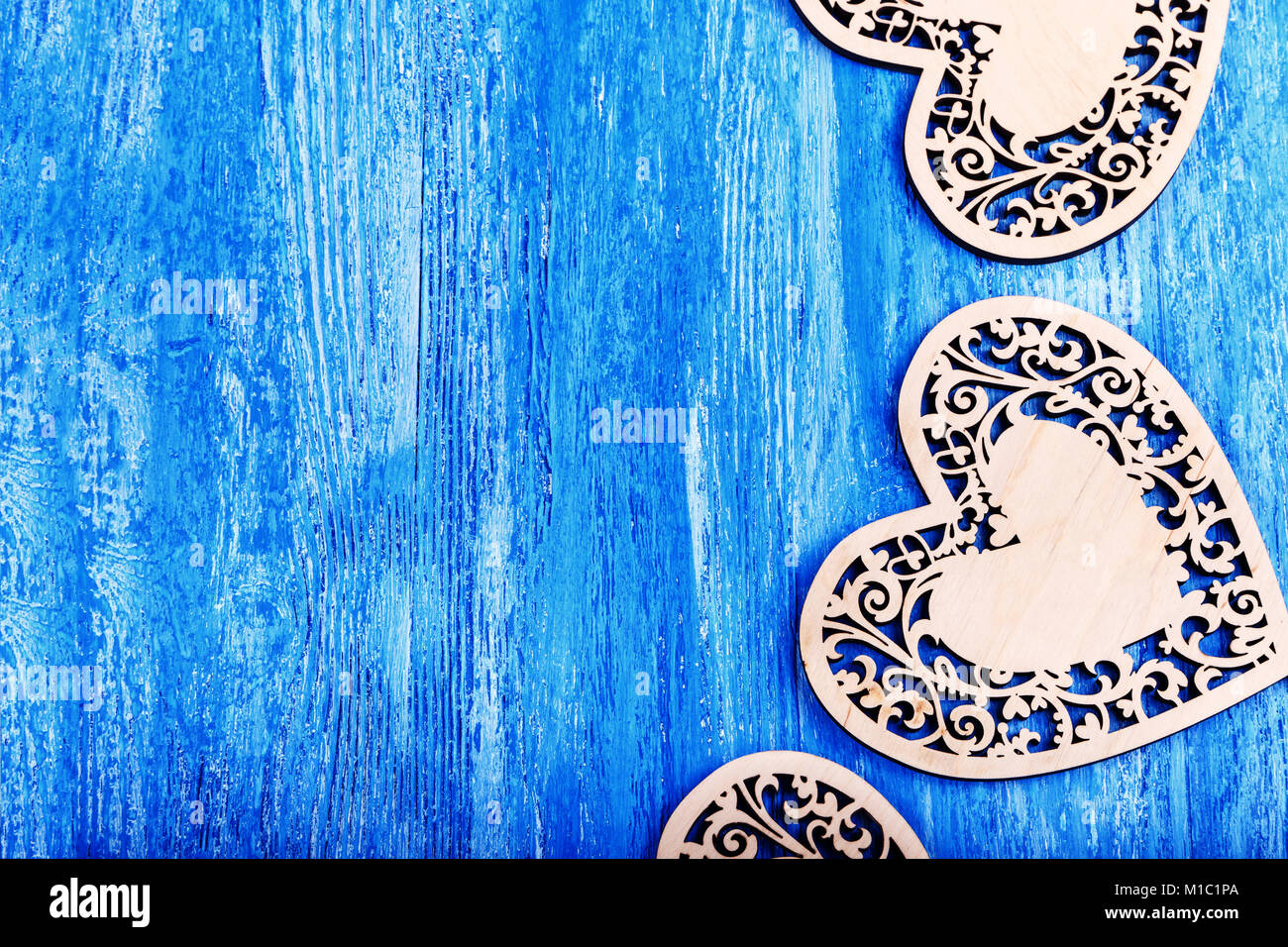 Patterns And Designs Of Green Wooden Heart On Blue Background With