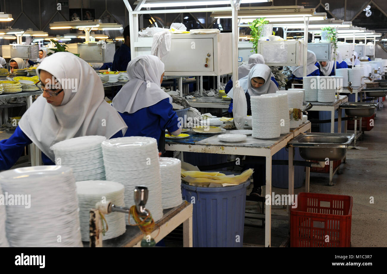 Iranian women work at the porcelain dishes production factory "Machsoud Factories Group" in the