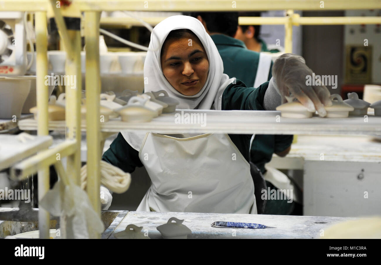 Iranian women work at the porcelain dishes production factory "Machsoud Factories Group" in the