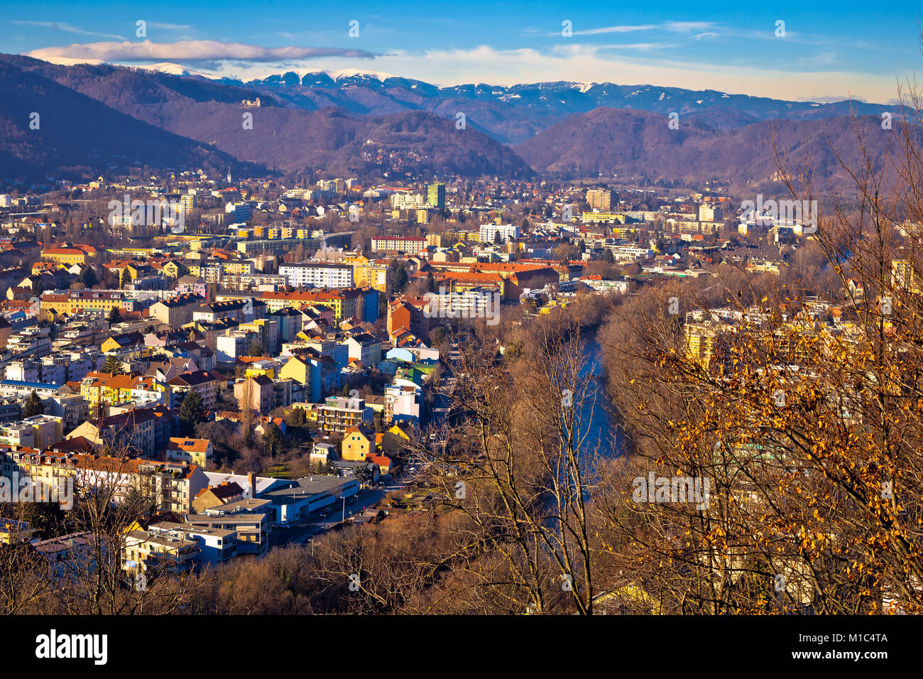 Graz and Mur river aerial cityscape view, mountains under snow ...