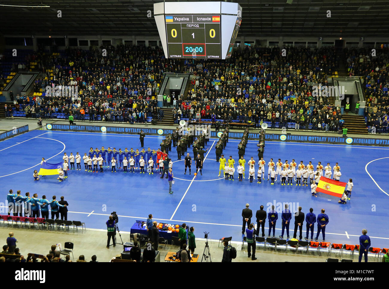 KYIV, UKRAINE - JANUARY 29, 2017: National Futsal Team of Ukraine (Left) and Spain listen to National anthems during their friendly Futsal match at Pa Stock Photo