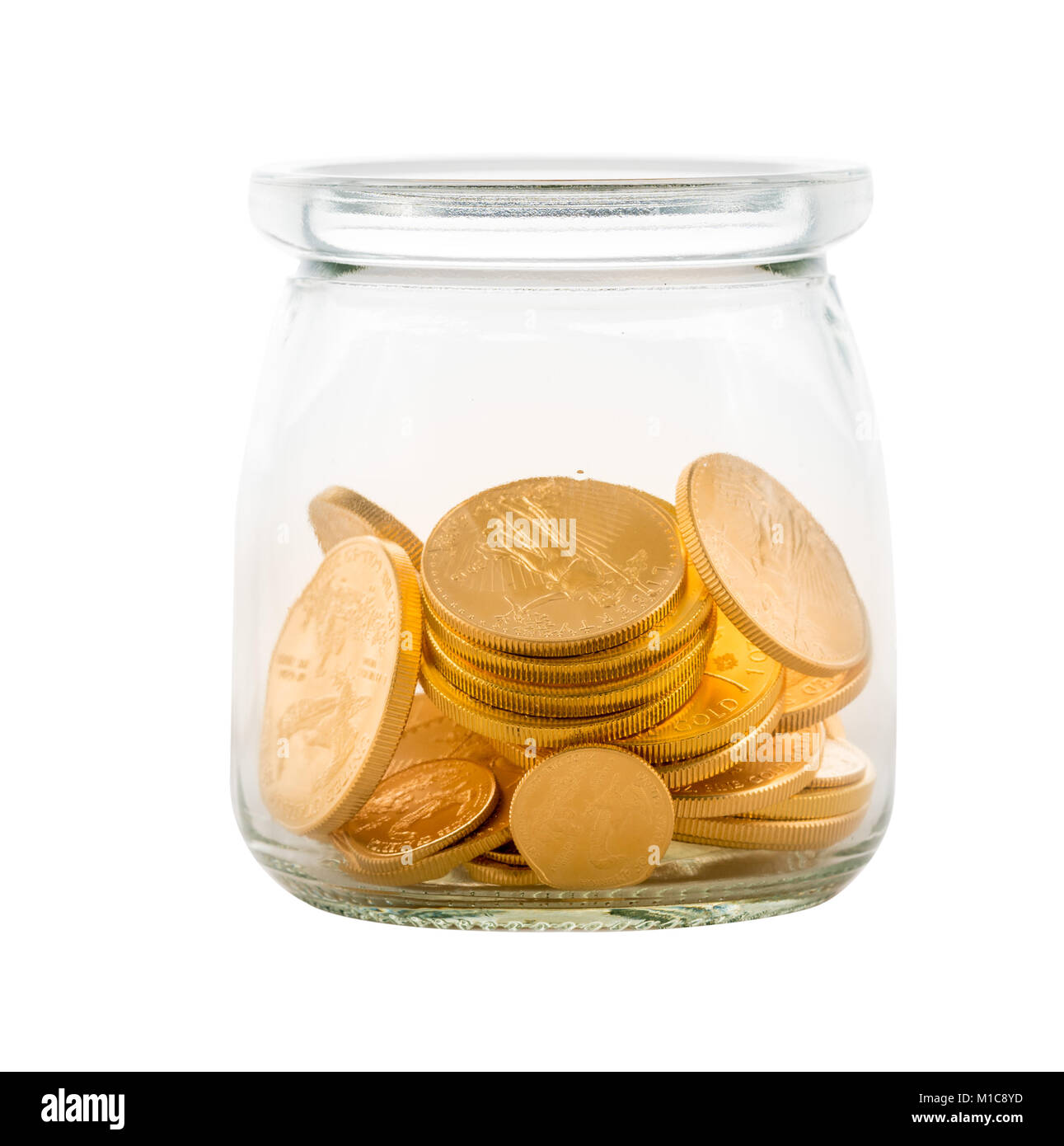 Gold coins inside glass jar to represent savings or investments Stock Photo
