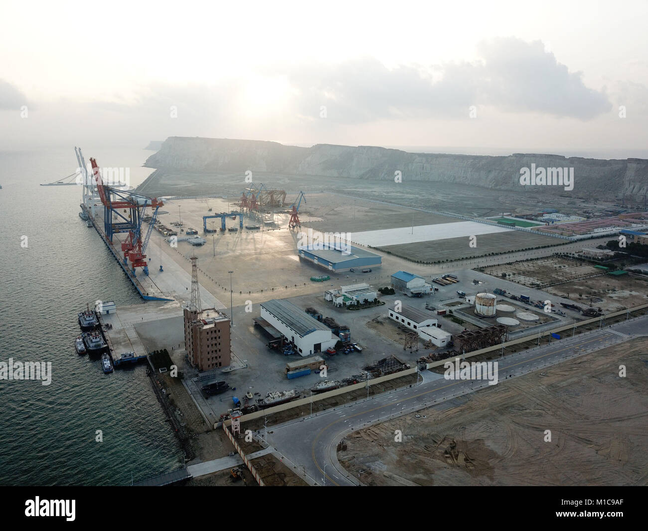 (180129) -- GWADAR, Jan. 29, 2018 (Xinhua) -- Photo taken on Jan. 29, 2018 shows a view of Gwadar port in southwest Pakistan's Gwadar. The first phase of Gwadar Port's Free Zone in southwestern Pakistan was inaugurated on Monday by Prime Minister Shahid Khaqan Abbasi, who commented that the free zone would help facilitate regional and global trade under the China-Pakistan Economic Corridor (CPEC). (Xinhua/Ahmad Kamal) (psw) Stock Photo