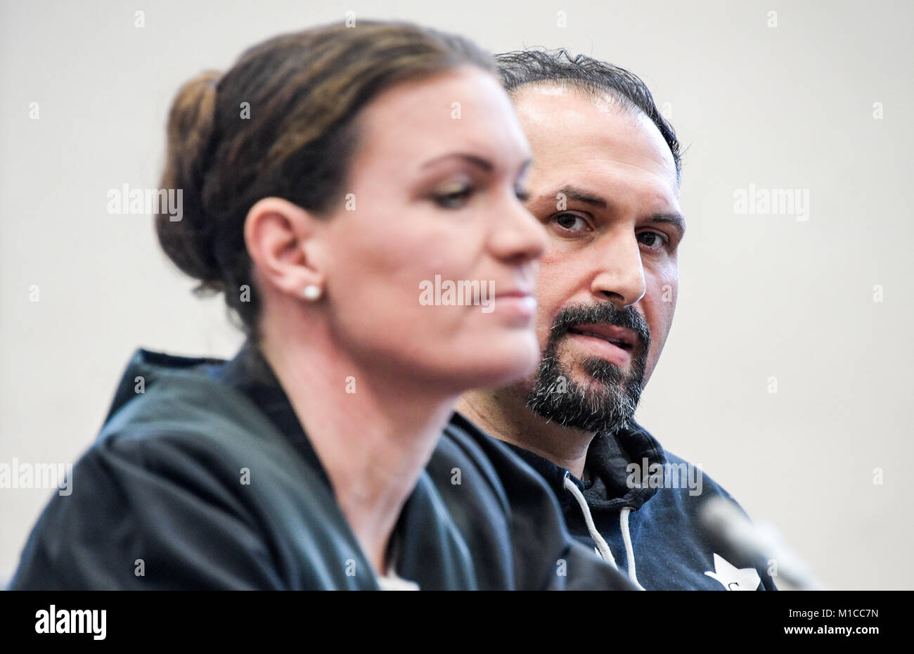 Hamburg, Germany. 29th Jan, 2018. A 30-year-old defendant and his lawyer Svenja Gruhnwald await his verdict at a court in Hamburg, Germany, 29 January 2018. He is guilty of scamming several elderly persons by pretending to be their grandchild. Credit: Axel Heimken/dpa/Alamy Live News Stock Photo