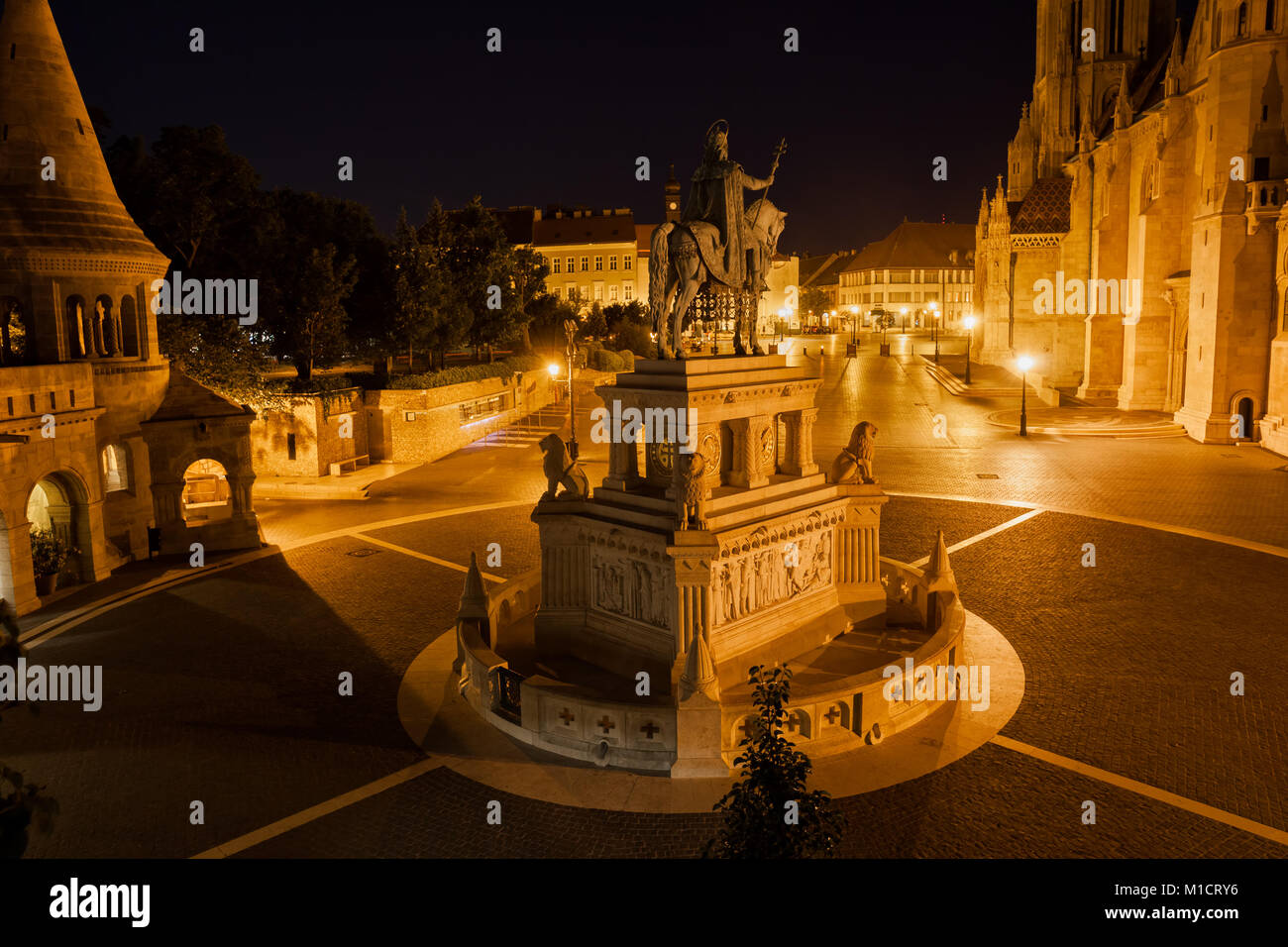 City of Budapest in Hungary at night, King St. Stephen (1906) monument on Holy Trinity Square Stock Photo