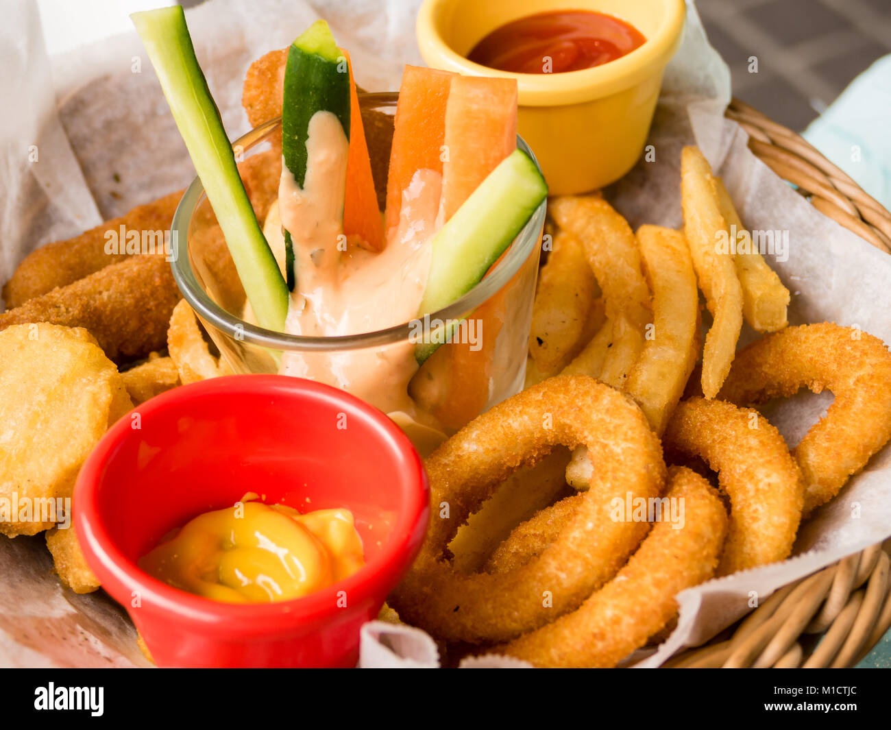 Platter of fried food, cheese sticks, onion rings, chicken nuggets