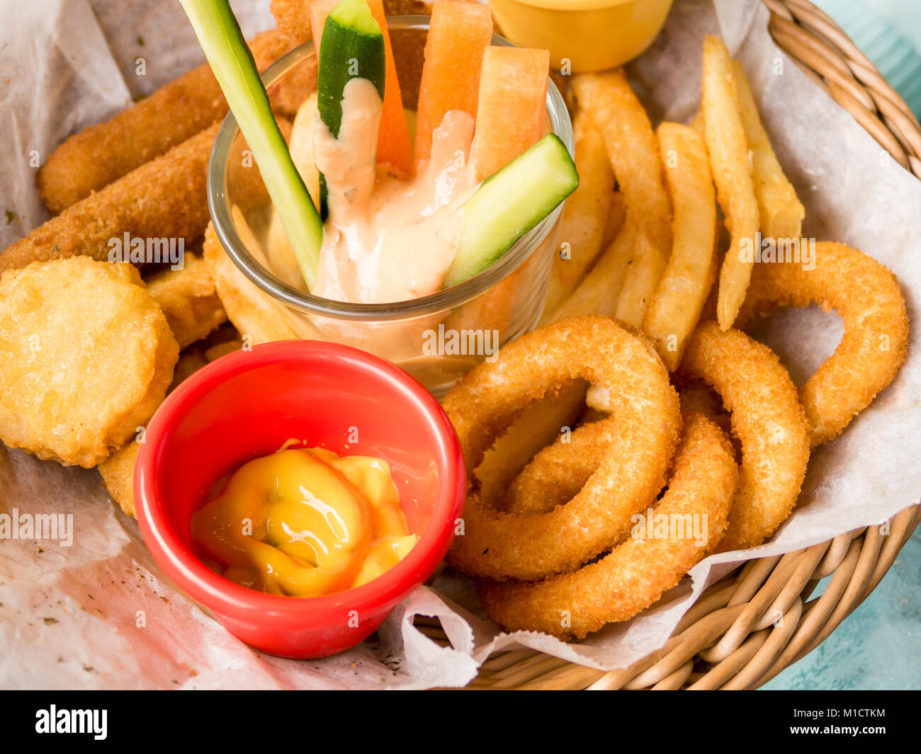 Platter of fried food, cheese sticks, onion rings, chicken nuggets Stock  Photo - Alamy