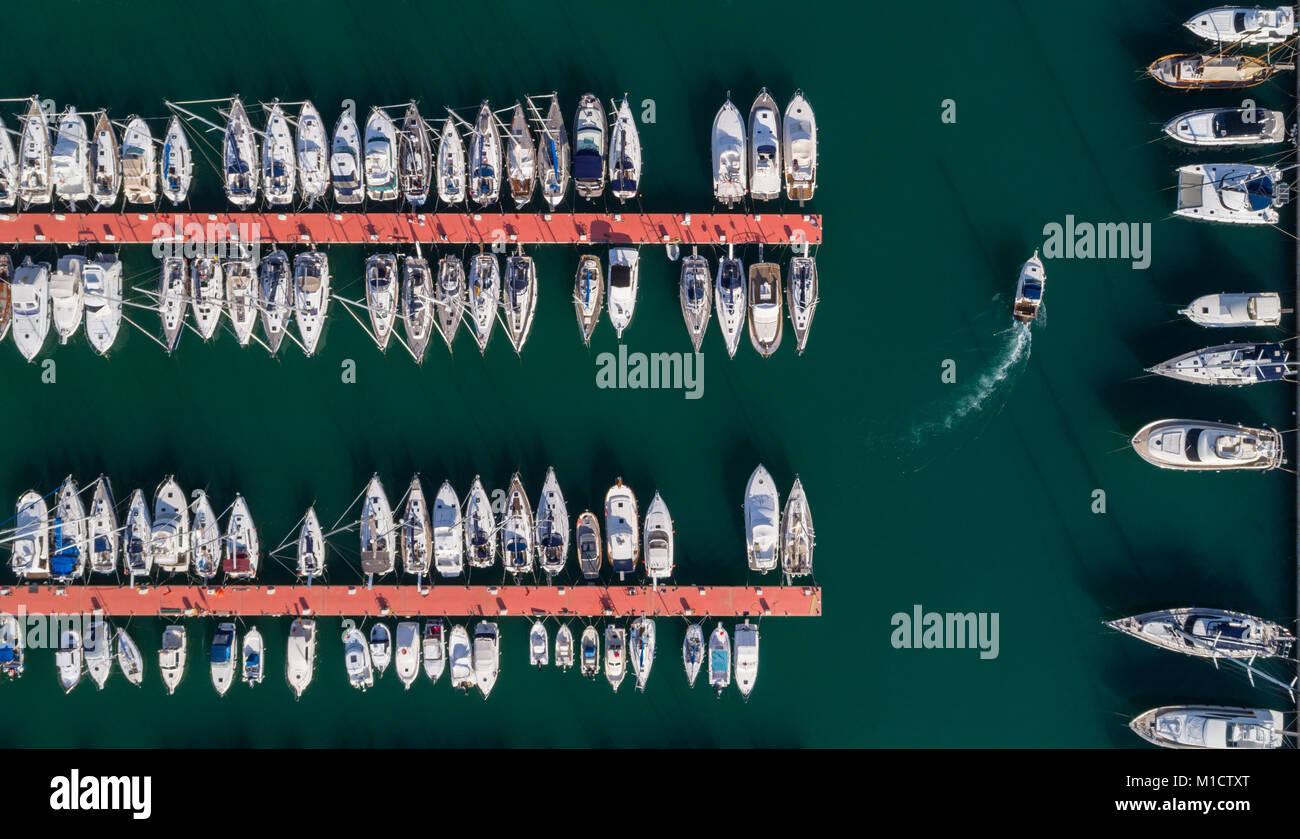 Boats moored along the jetty at harbor Stock Photo - Alamy