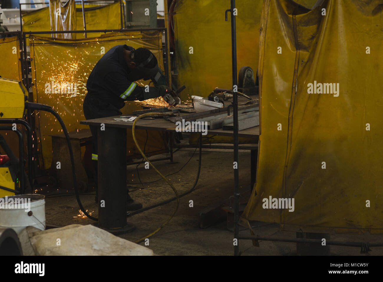 Welder repairing vessel part Stock Photo