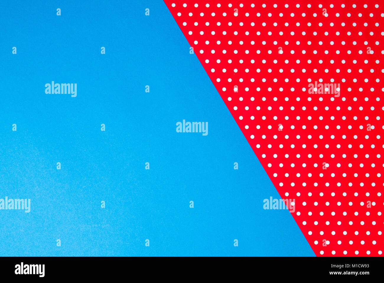 Abstract geometric blue and red polka dot paper background. Stock Photo