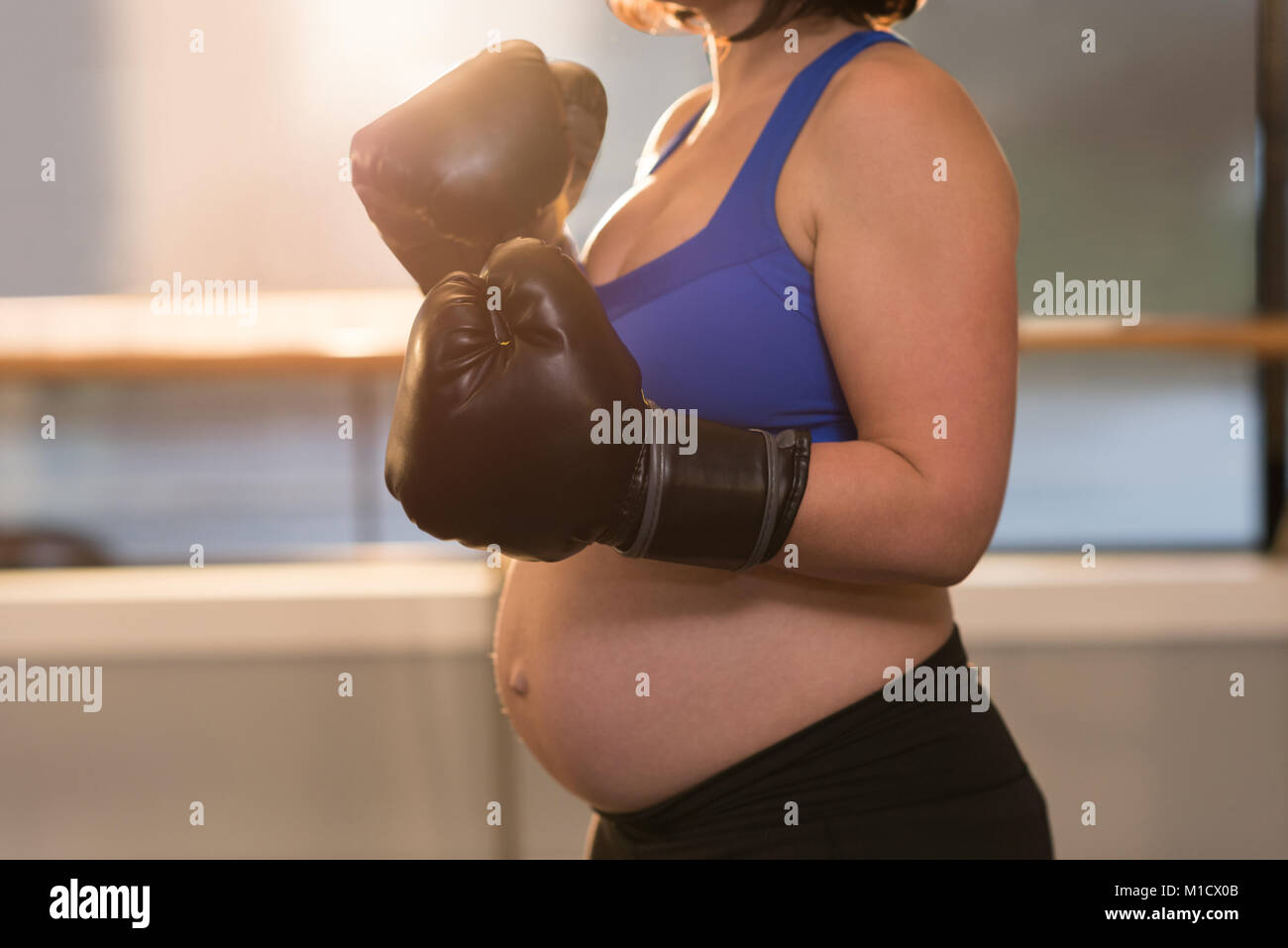 Woman with boxing gloves hi-res stock photography and images - Alamy