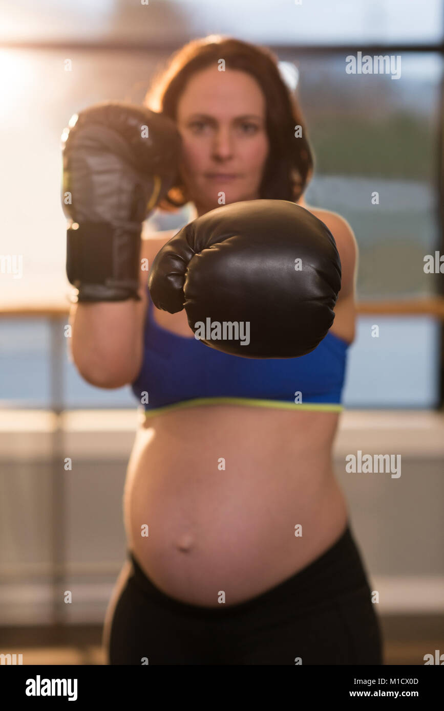 Pregnant woman practicing boxing in living room Stock Photo Alamy