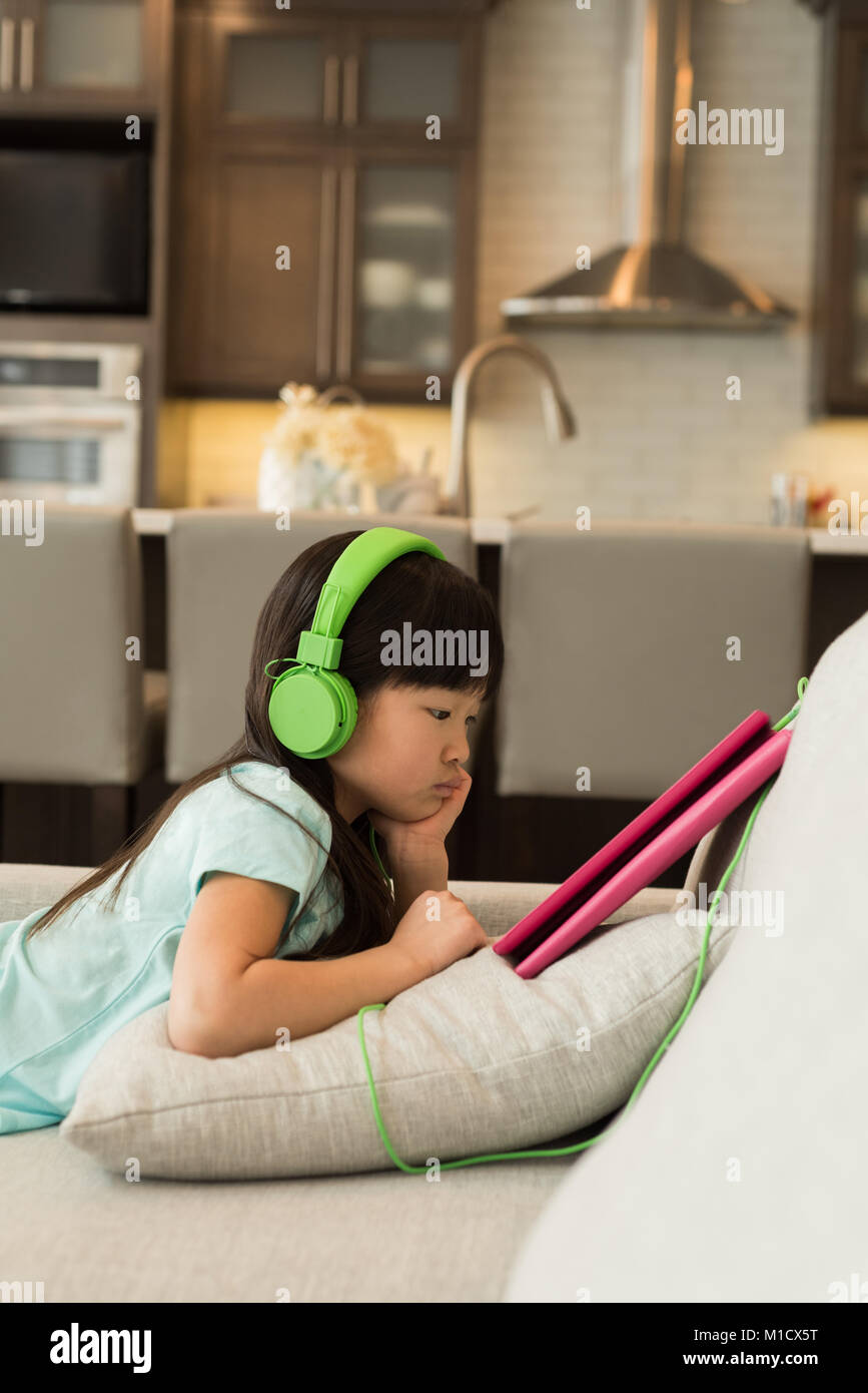 Focused asian woman headphones hi-res stock photography and images - Alamy
