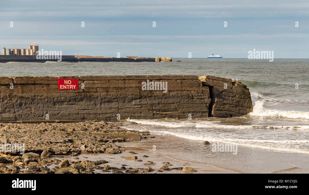 North sea coast with abroken wall at Grangetown Beach, Tyne and Wear, UK Stock Photo
