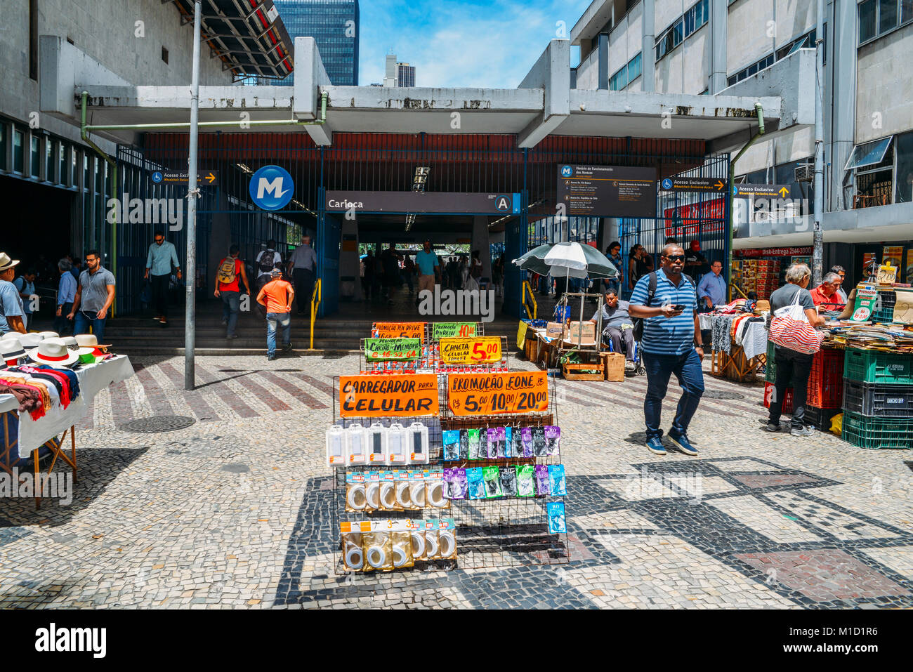 Street sellers in downtown Rio de Janeiro selling items such as electronics, books, food and clothes Stock Photo