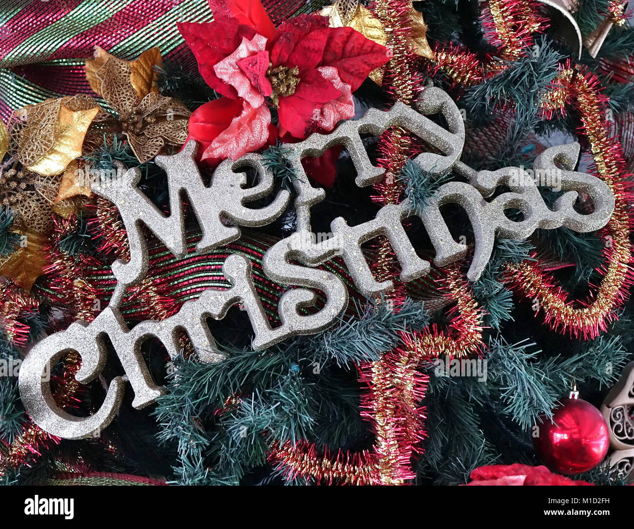 Christmas tree detail with Merry Christmas letters and colorful ...