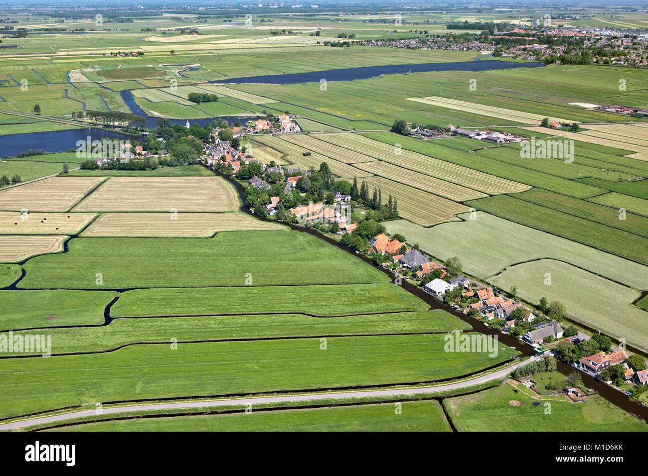 The Netherlands, Zuiderwoude. Aerial. View of village and polder landscape. Stock Photo