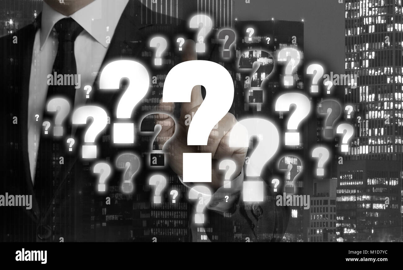 Question marks are shown by businessman concept. Stock Photo