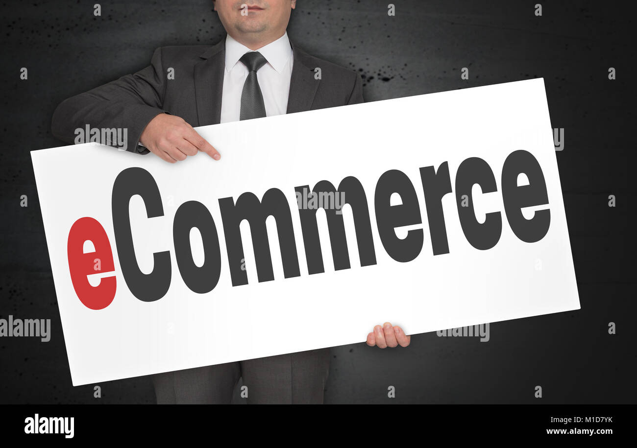 eCommerce poster is held by businessman. Stock Photo