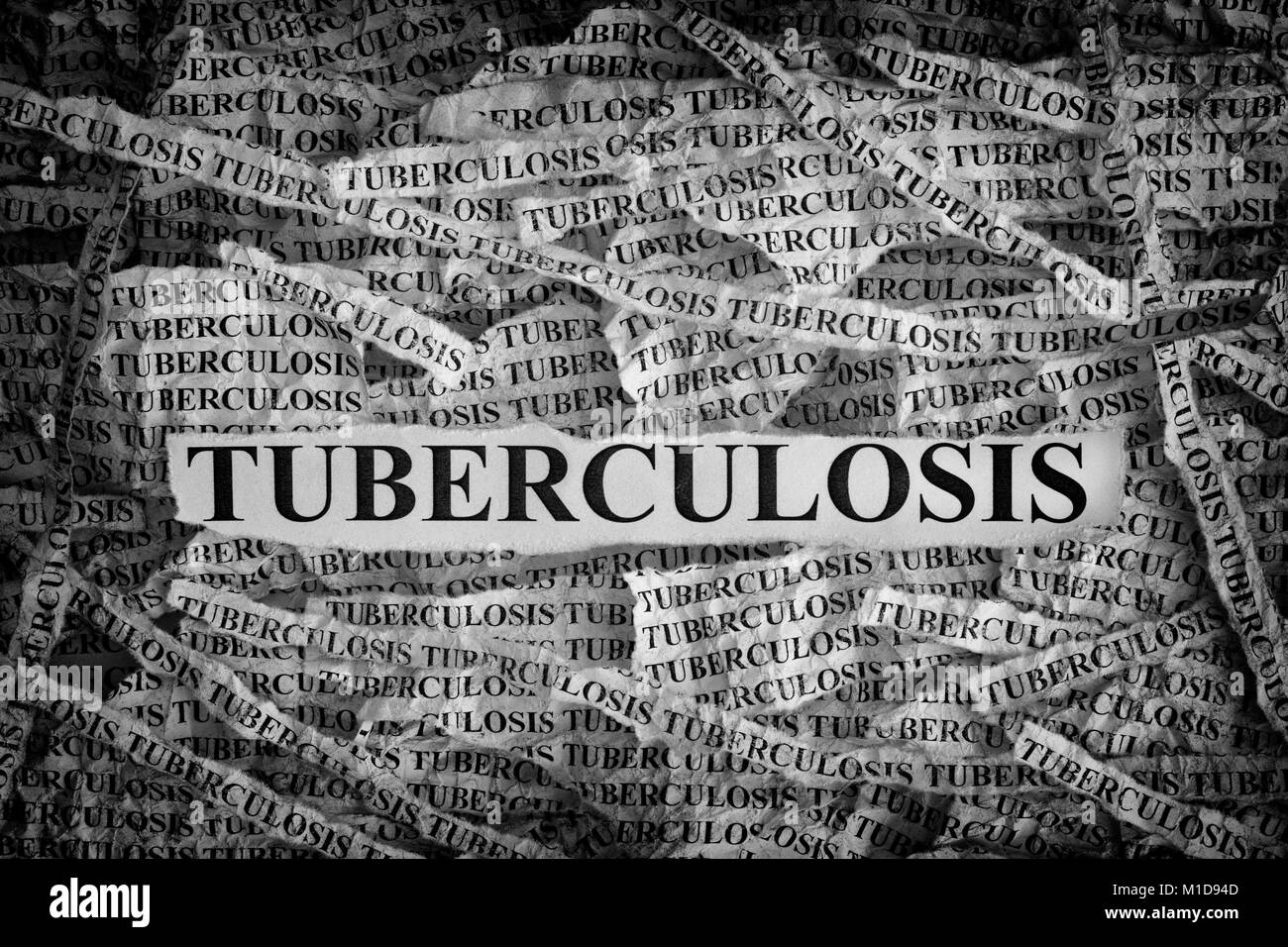 Tuberculosis. Torn pieces of paper with the word Tuberculosis. Concept Image. Black and White. Closeup. Stock Photo