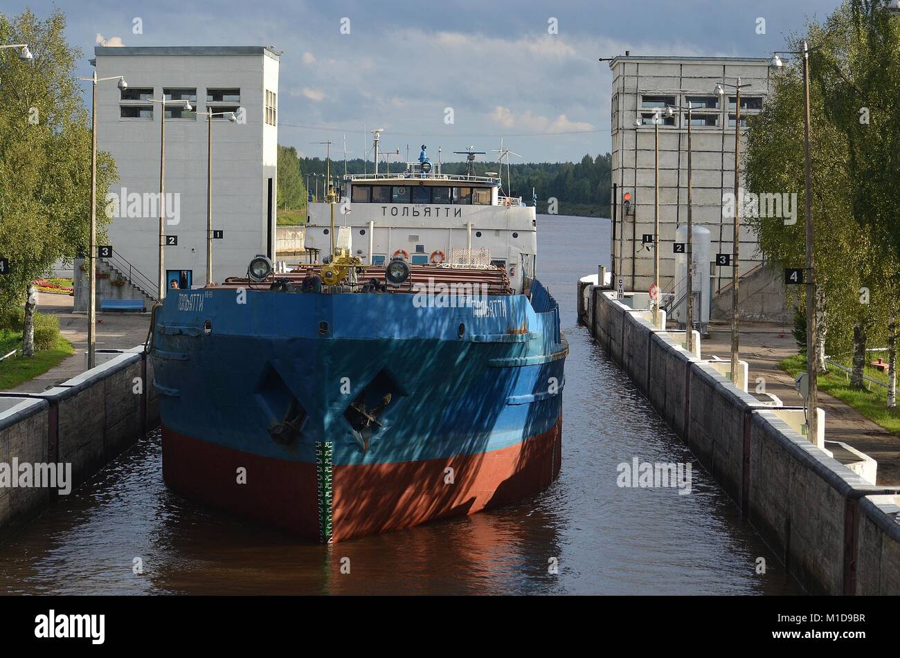 FREIGHTER 'TOLYATTI'  IN LOCK 1 ON THE KOVZHA RIVER BOUND FOR LAKE LADOGA, RUSSIA. Stock Photo