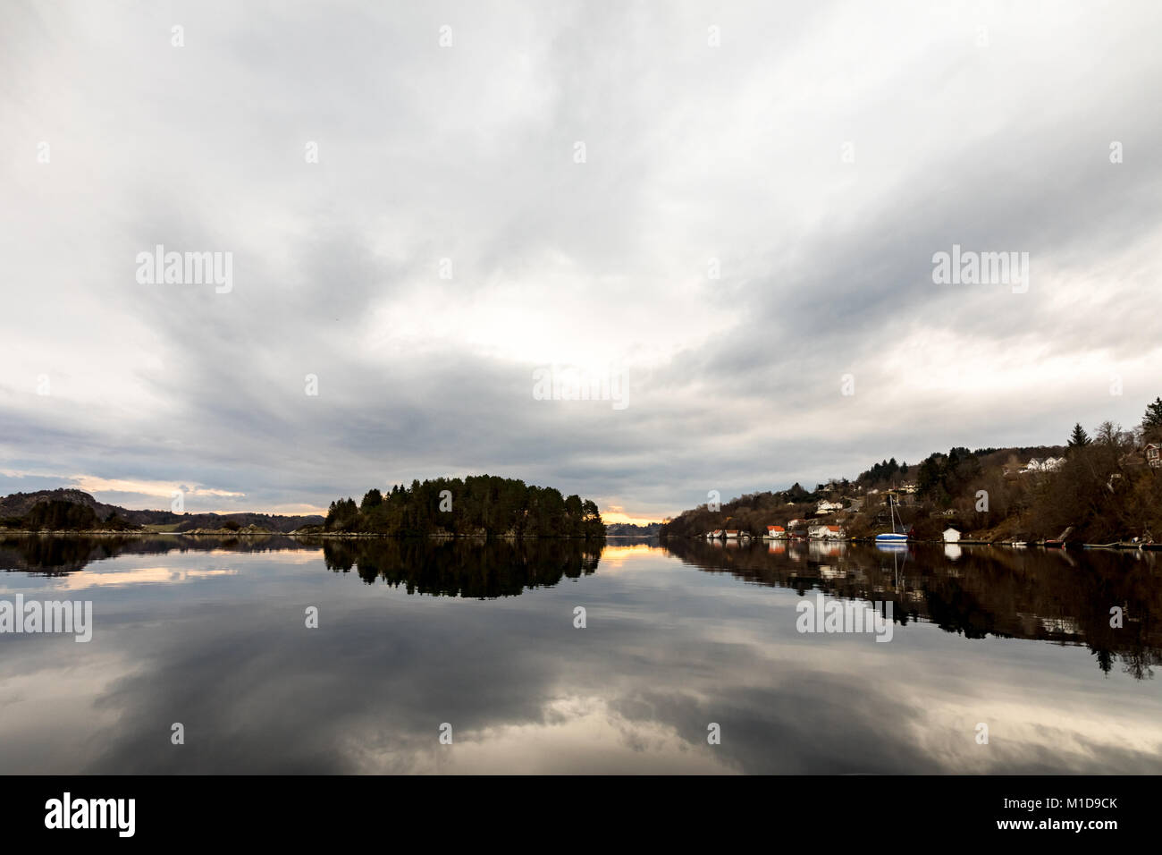Kolnes in Norway: View of the fjord Forresfjorden in the norwegian west coast. Beautiful sky and blue light Stock Photo