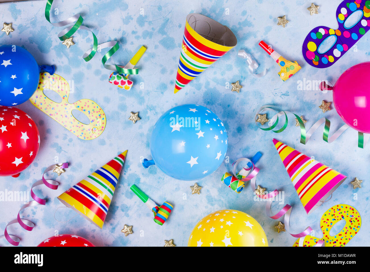 Party background with balloons, streamers and confetti on pastel blue  background. Birthday party decoration Stock Photo - Alamy